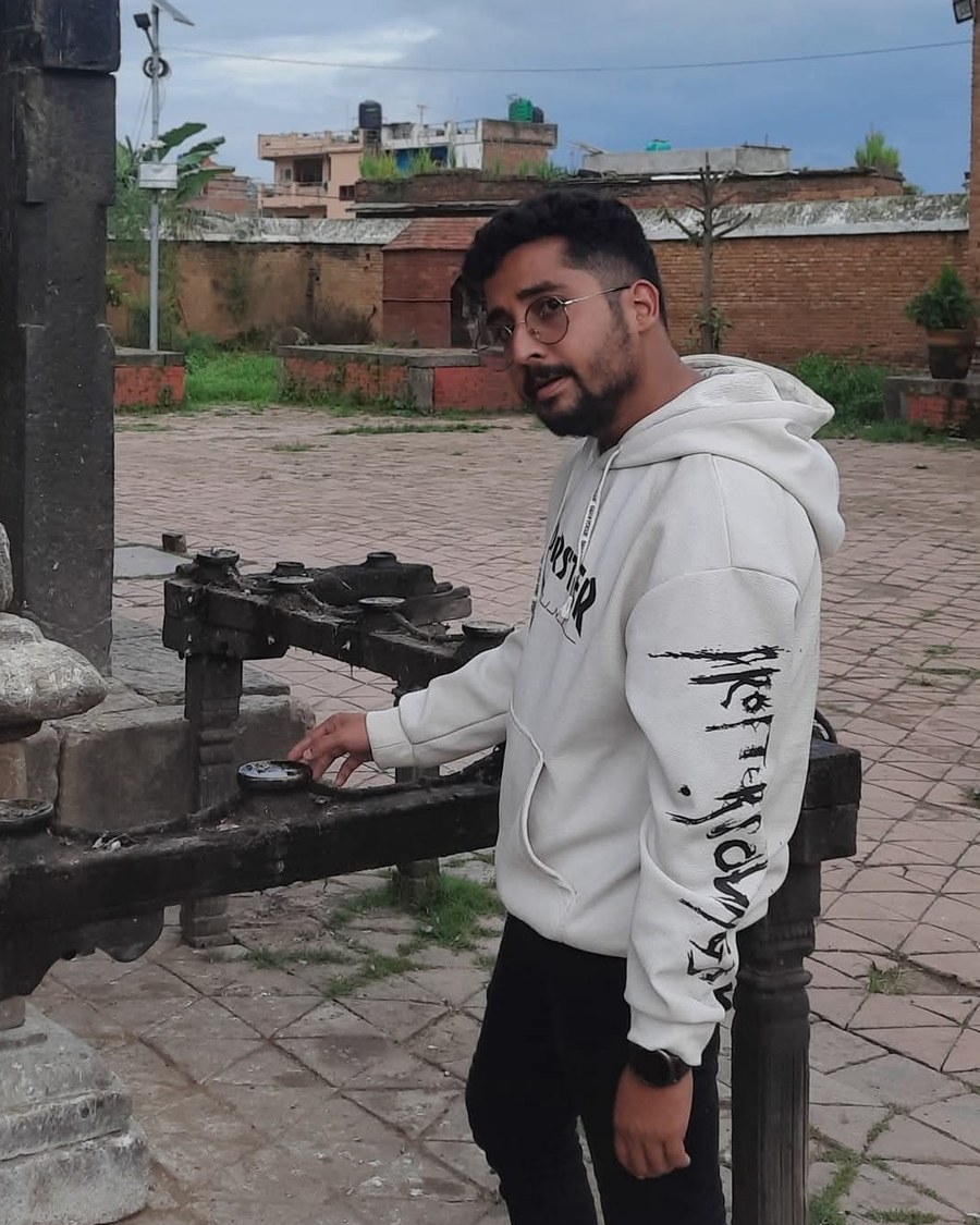 Sujan Dahal at a temple courtyard in Nepal